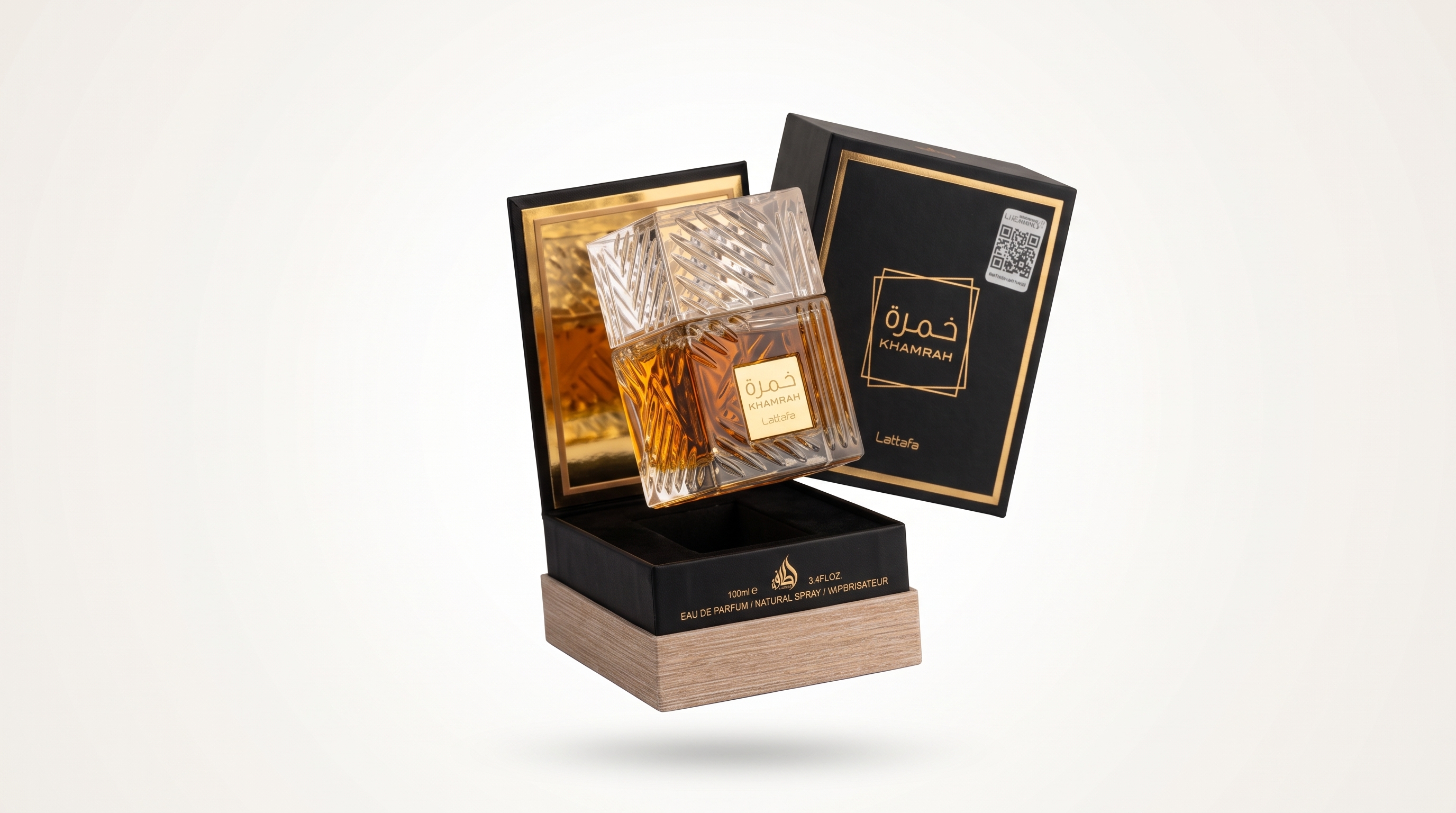 Khamrah de Lattafa: frasco de Eau de Parfum con caja negra y dorada de diseño oriental